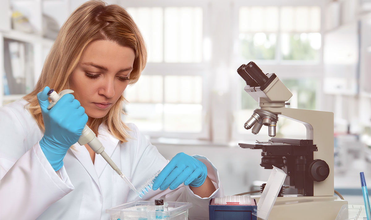Young Female Tech Or Scientist Loads Liquid Sample Into Test Tubes